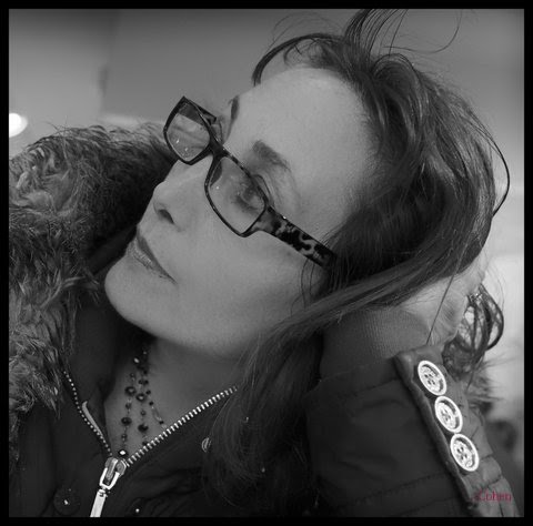 Elizabeth Levine wearing glasses and looking upward